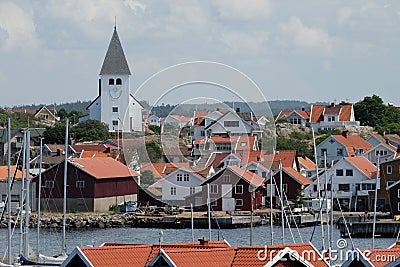 View over a small swedish village and a church with a smiling face Stock Photo