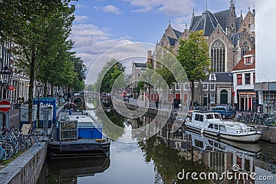 View over a typical canal in the Dutch metropolis Amsterdam in summer 2023 Editorial Stock Photo