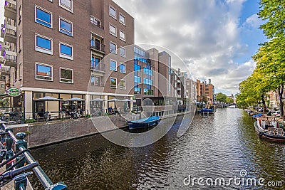 View over a typical canal in the Dutch metropolis Amsterdam in summer 2023 Editorial Stock Photo