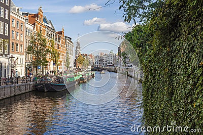 View over a typical canal in the Dutch metropolis Amsterdam in summer 2023 Editorial Stock Photo