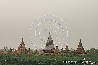 View of Pagodas and temples of Bagan, in Myanmar, formerly Burma, a world heritage site in amusty day during its sunrise Stock Photo