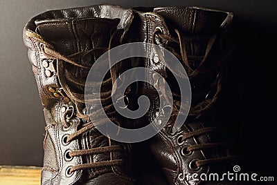 CLOSE VIEW OF A PAIR OF COMBAT BOOTS WITH LOOSE LACES Stock Photo
