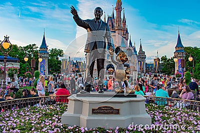 View of Partners Walt Disney and Mickey Mouse statues and colorful flowers at Magic Kingdom in Walt Disney World. Editorial Stock Photo