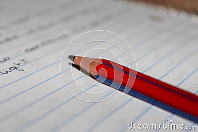 View of pencil over a notebook with writings Stock Photo