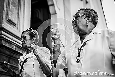 View of people at the religious Mass of Santo Antonio de Categero in Rosario dos Pretos church Editorial Stock Photo