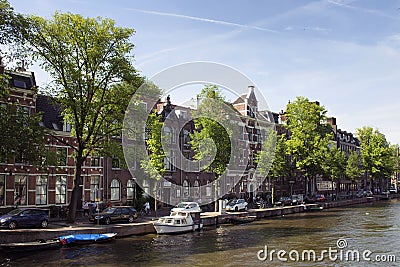 View of people riding bicycles on street, trees Editorial Stock Photo