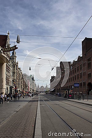 View of people walking on Damrak avenue. Editorial Stock Photo