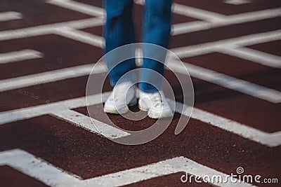 View of a person feet legs trapped and trying to find escape and exit from maze labyrinth, concept of finding solution to problem Stock Photo