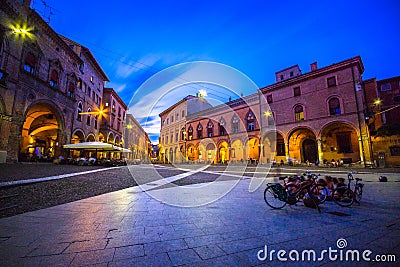View of the piazza Santo Stefano at the evening with people and a bicycle, Bologna, on July 13, 2017. Editorial Stock Photo
