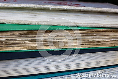 View on pile of antique yellowed books with edges of cover and textblock Stock Photo