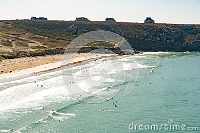 View of the Plage de Pen Hat beach and bay with many surfers Editorial Stock Photo