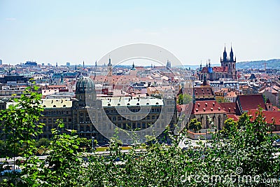 View of Prague and river Vltava with ships and amazing buildings with red roofs. Stock Photo