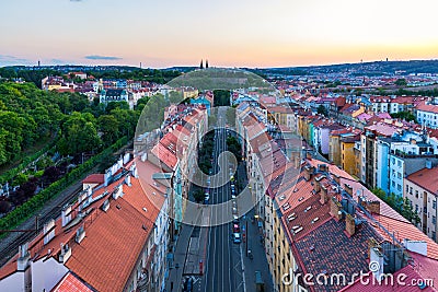 View of Prague taken from Nuselsky bridge (Nusle Bridge). Famous Vysehrad fort is behind it with Basilica of St. Peter and St. Stock Photo