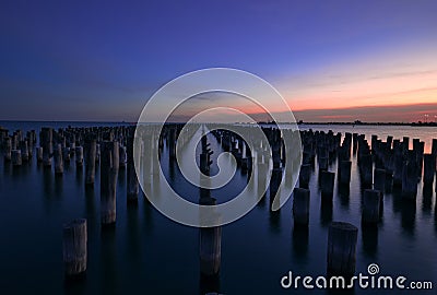 View of Princess pier with old wooden structures at sunset Stock Photo