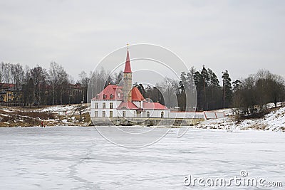 View of Priory Palace on the Black lake on a cloudy afternoon. Gatchina Editorial Stock Photo