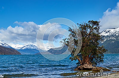 A view of the Puelo lake in Chubut, patagonia Argentina, on spring day. Beautiful landscape with snowy mountains and clouds on the Stock Photo