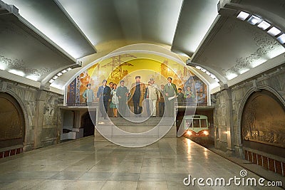 A view of Puhung Station, mosaic and train. Mangyongdae Line of the Pyongyang Metro. DPRK - North Korea. Editorial Stock Photo