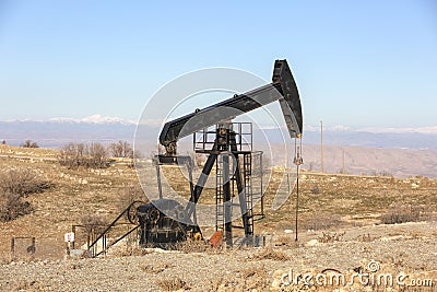 View of Pumpjack at Daylight Oil Industry Stock Photo