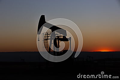 View of Pumpjack at Sunset Stock Photo