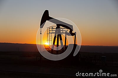 View of Pumpjack at Sunset Stock Photo