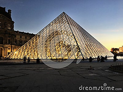 A view of the Pyramid outside the Louvre Museum Editorial Stock Photo