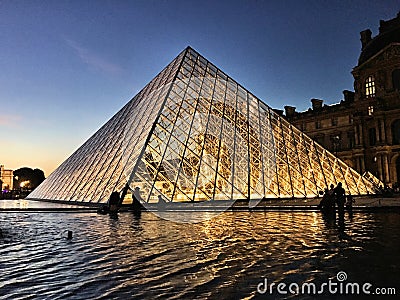 A view of the Pyramid outside the Louvre Museum Editorial Stock Photo