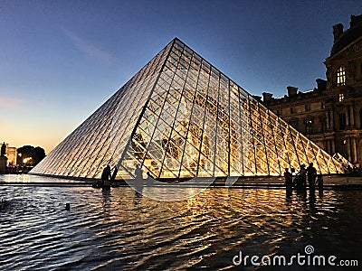 A view of the Pyramid outside the Louvre Museum Editorial Stock Photo