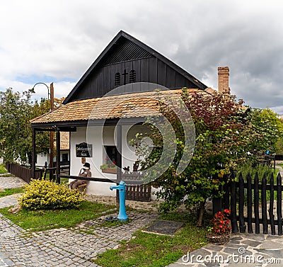 View of a quaint and traditional Hungarian house in the historic village center of Holloko Editorial Stock Photo