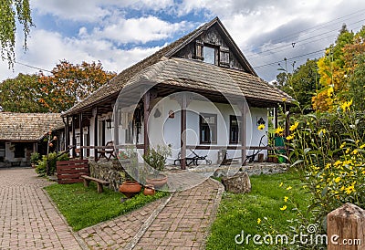 View of a quaint and traditional Hungarian house in the historic village center of Holloko Editorial Stock Photo