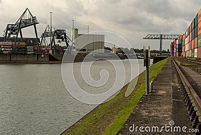 View of quay cranes in the port. Niehler Hafen, Cologne, Germany. Editorial Stock Photo