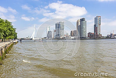 A view of the quay of the river Maas and the imposing buildings at the Erasmus bridge Editorial Stock Photo