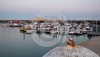 View of Ramsgate Royal Harbour taken in the early evening light, with the masts of the yachts reflected in the water. Stock Photo