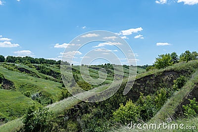 View ravine covered with greenery. Landscape valley with geological faults. Stock Photo
