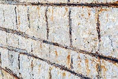 View of the rebars corrosion in the concrete. Rebar corrosion occurs when chloride ions migrate to concrete material. Stock Photo