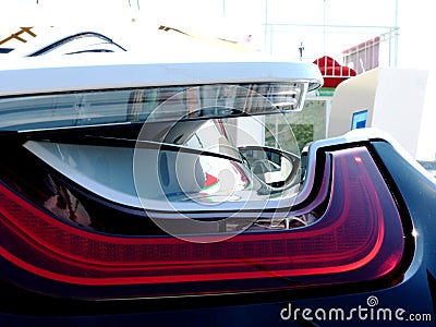 view through the red tail light of a modern sports car Stock Photo