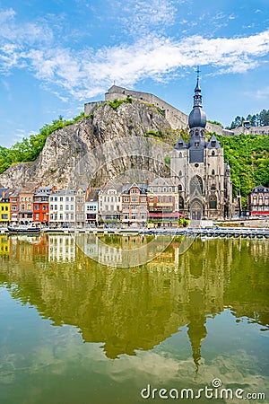 View at the reflection of houses and church of Our Lady Assumption in Dinant - Belgium Stock Photo