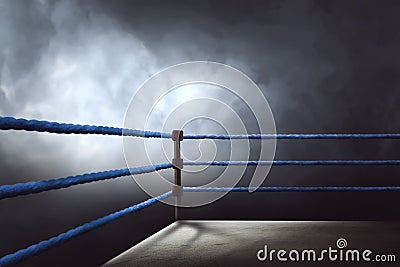 View of a regular boxing ring surrounded by blue ropes Stock Photo