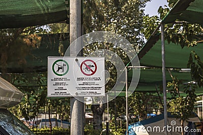 View of regulating signs for dogs near camping. Greece. Stock Photo