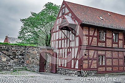 View of restored fortres buildings and fortifications built of large granite stones on a summer day Stock Photo