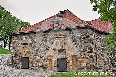 View of restored fortres buildings and fortifications built of large granite stones on a summer day Stock Photo