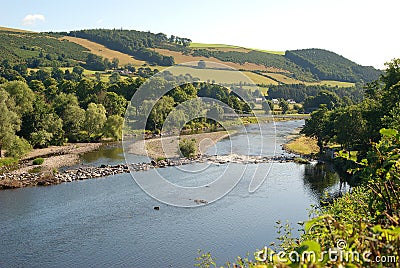 view of river Tweed hills and chain bridge at Melrose in summer Stock Photo