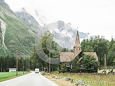 View of the road, church and mountains in Norway Stock Photo