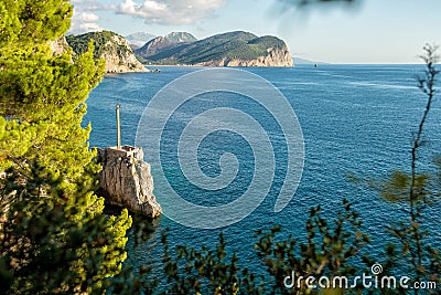 View of the rocky cape in the resort town of Petrovac. Stock Photo