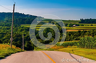 View of rolling hills and farms from a country road in York County, Pennsylvania. Stock Photo