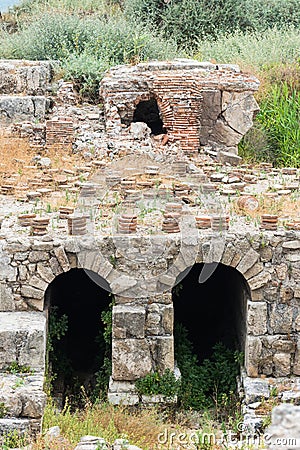 Roman bathhouse and columns in Al Mina archaeological site, Tyre, Lebanon Stock Photo