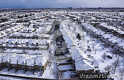 View of Roofs of Houses Covered with Snow Stock Photo