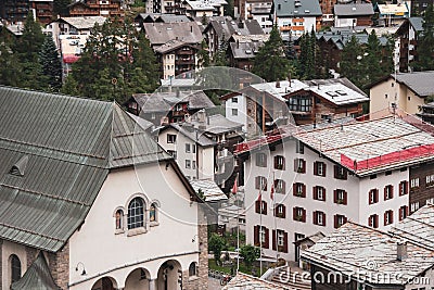 View of the roofs of houses in a Swiss resort. A place preserving authentic architecture. Natural stone roofs, wooden Stock Photo