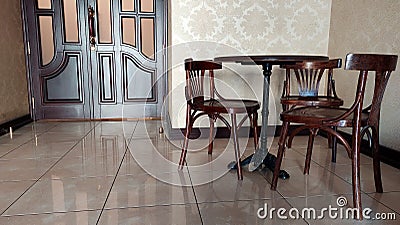 View of a room with a coffee table and chairs Stock Photo