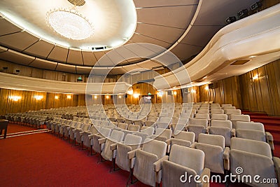 View on rows of chairs in empty cinema hall Stock Photo