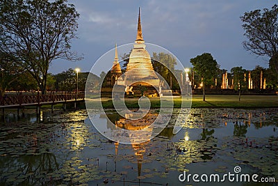 View of ruins of the ancient Buddhist temple of Wat Sa Si in evening twilight. Sukhothai. Thailand Stock Photo